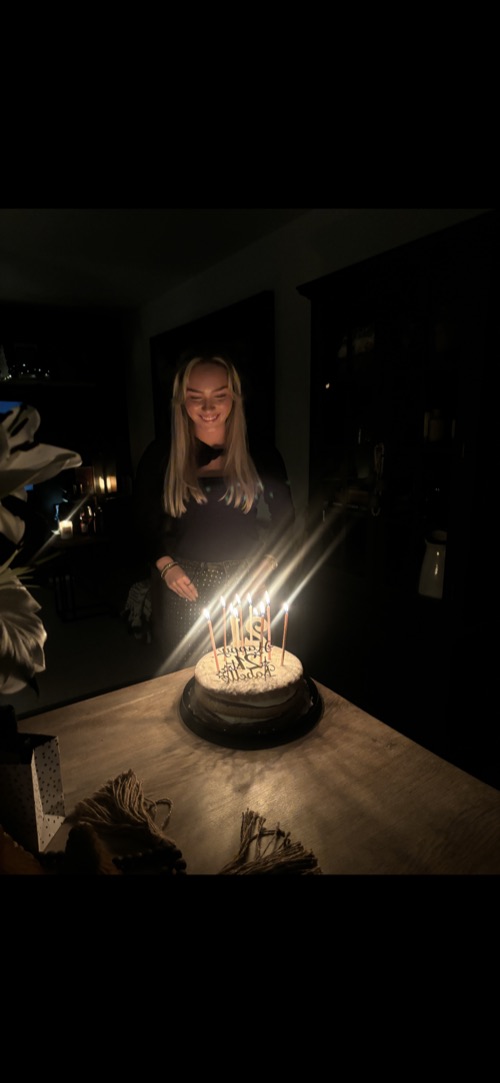 Belle celebrating her birthday with a cake