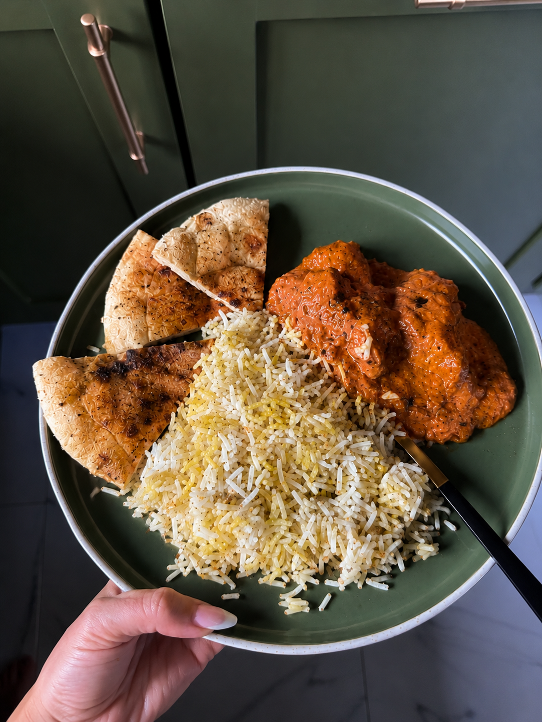 Chicken tikka masala with pilau rice and naan bread