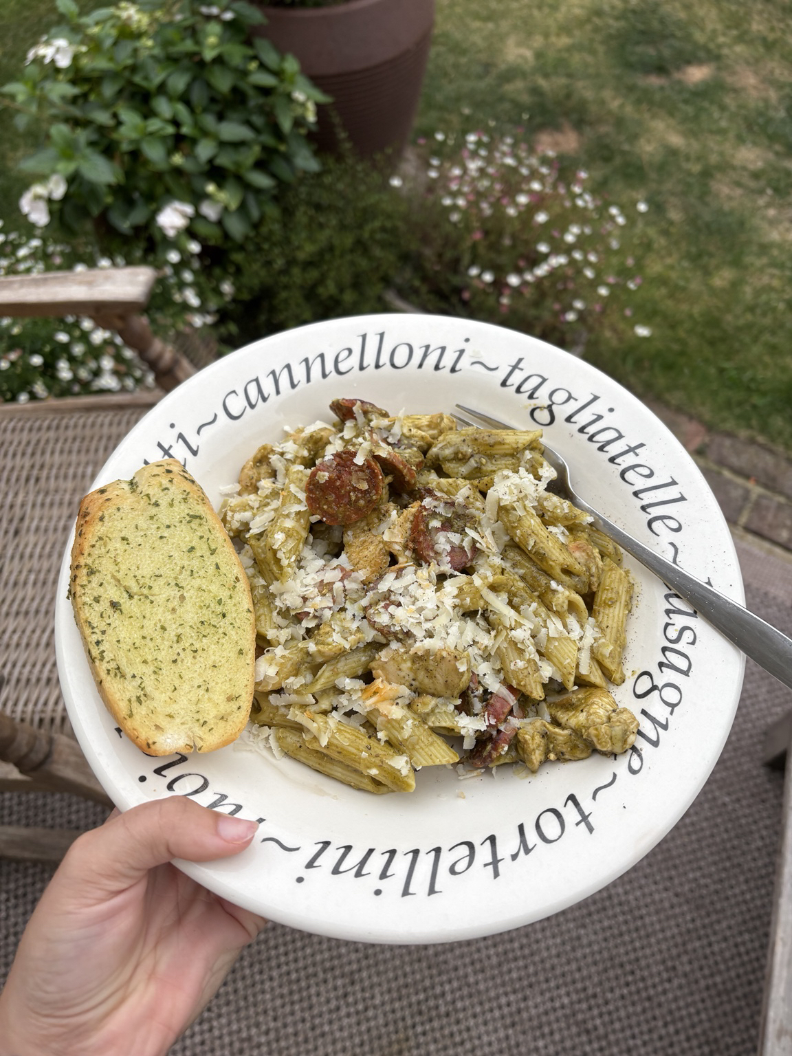 Chorizo pesto pasta with parmesan and garlic bread