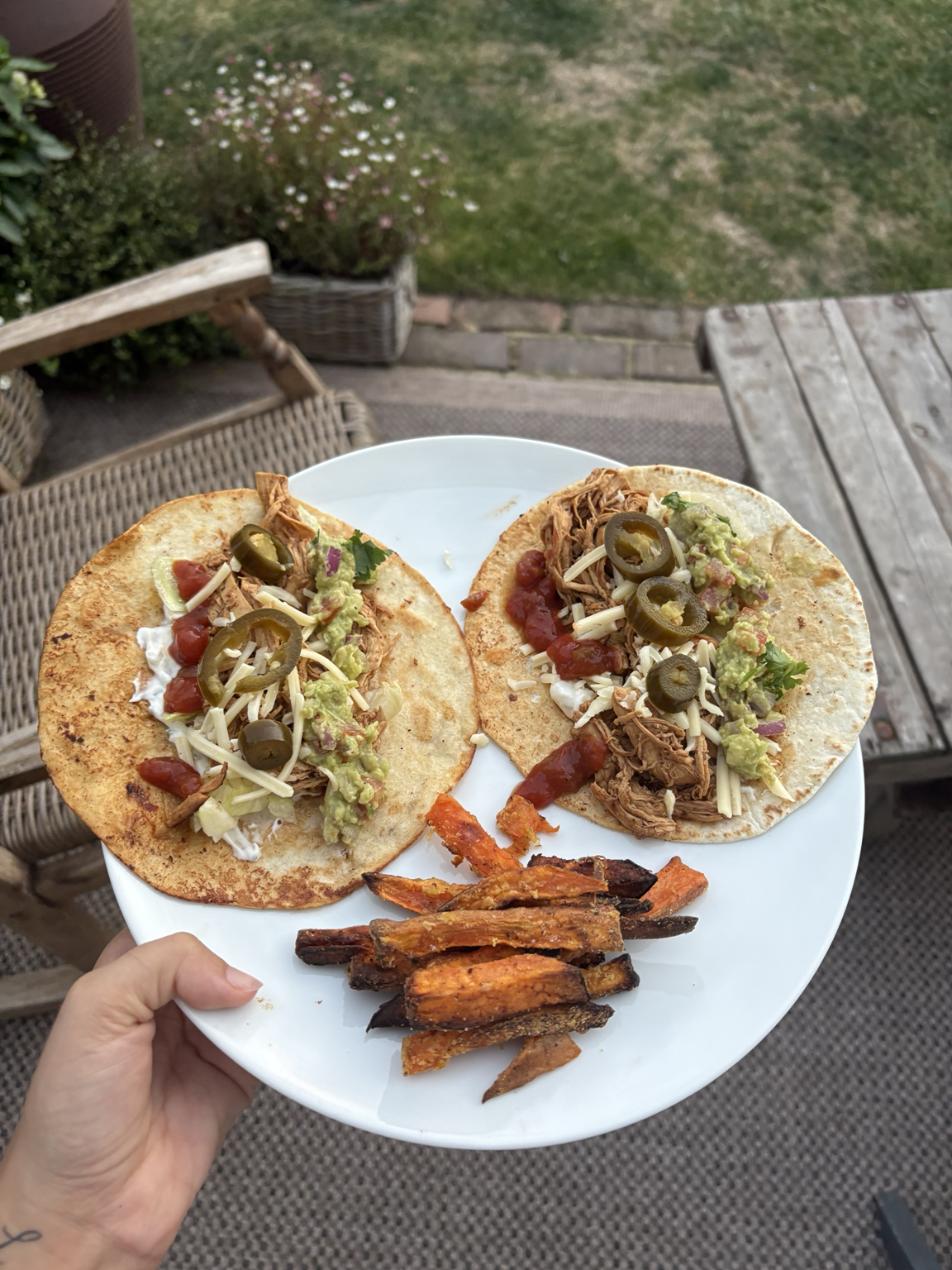 Soft fajita chicken tacos with jalapeños, guacamole and sweet potato fries